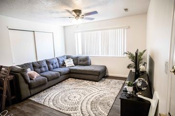Provo apartment for rent - a living room with a couch and a ceiling fan