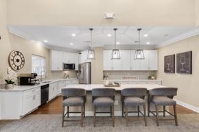 Novi apartment for rent - a kitchen with a large island with four chairs