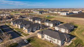 Fargo townhouse for rent - A large group of houses are shown from an aerial view.