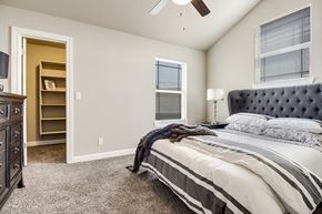 Kansas City townhouse for rent - a bedroom with a bed and a closet