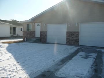 Kearney apartment for rent - a house with a driveway covered in snow