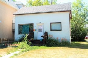 Brandon apartment for rent - a small white house with a porch and a backdoor
