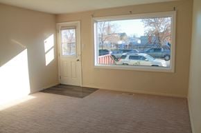 Brandon apartment for rent - an empty living room with a large window