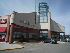 Fargo apartment for rent - A Noodles & Company restaurant with a car parked in front.