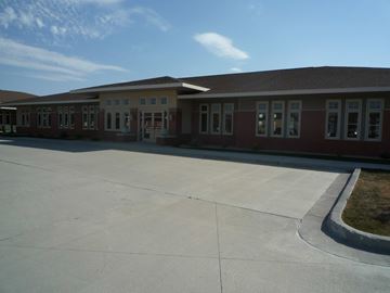 Fargo apartment for rent - A long building with a lot of windows and doors.