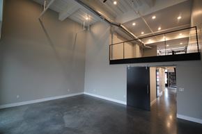 Lincoln apartment for rent - a large room with a concrete floor and a staircase in a building