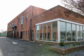 Richmond apartment for rent - the front of a brick building with large windows