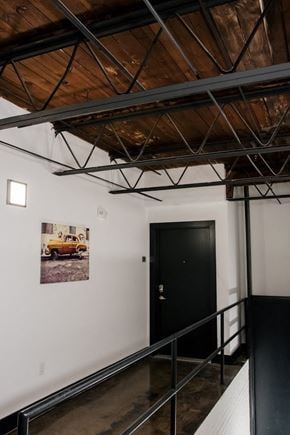Richmond apartment for rent - a room with a black door and a picture of a truck on the wall