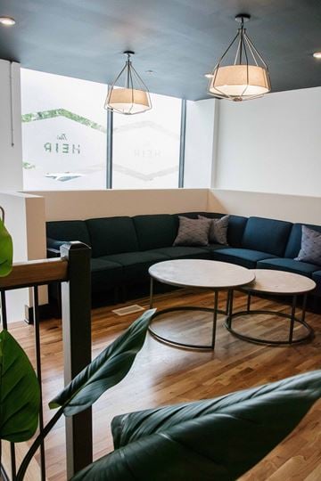 Roanoke apartment for rent - a living room with blue couches and tables