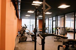 Roanoke apartment for rent - a gym with a lot of machines and mirrors in it