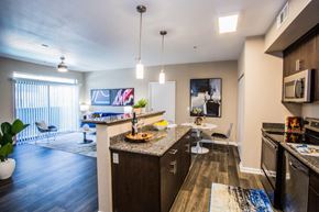 Las Vegas apartment for rent - A kitchen with a dining table and chairs.