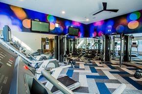Las Vegas apartment for rent - A gym with a variety of equipment including treadmills, weights, and exercise machines.