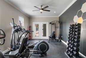 Sherwood apartment for rent - A spacious home gym with a variety of exercise equipment.