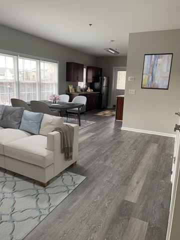 Milford apartment for rent - a living room with a couch and a chair and a table