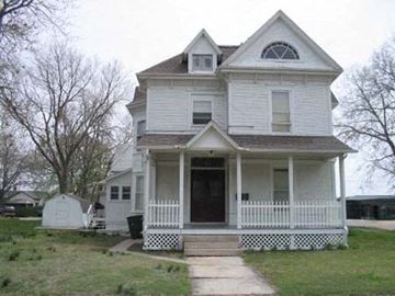 Kearney apartment for rent - a white house with a porch and