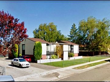 West Valley City apartment for rent - A white car is parked in front of a house.
