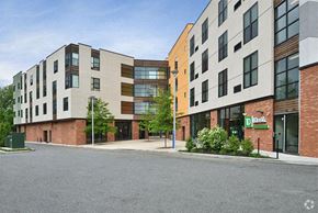Chester apartment for rent - a group of buildings on the side of a street