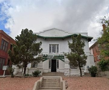 El Paso apartment for rent - A white building with a green roof and a sign that says "Casa de la Cultura".
