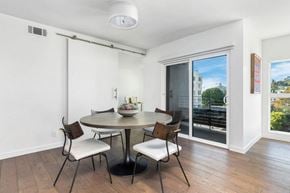West Hollywood apartment for rent - A dining room with a round table and chairs.