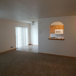 West Fargo townhouse for rent - a view of a living room and a kitchen with a window