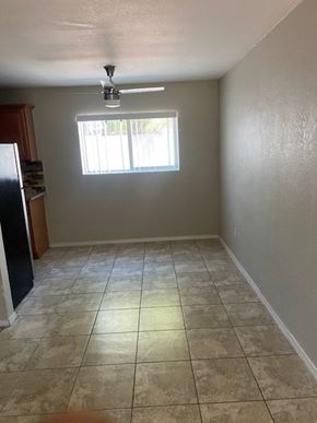 Phoenix apartment for rent - an empty room with a ceiling fan and a window