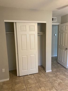 Phoenix apartment for rent - an empty room with a closet and two doors