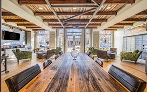 Greenville apartment for rent - a large dining room with a large wooden table and chairs