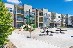 Iowa City apartment for rent - an empty playground in front of an apartment building