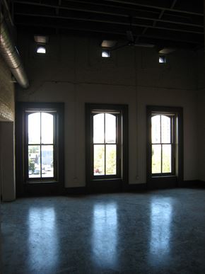 Louisville apartment for rent - an empty room in a building with three windows