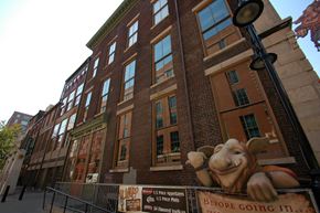 Louisville apartment for rent - a statue of a bull in front of a building