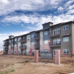 Hickman apartment for rent - an apartment building with a sign in front of it
