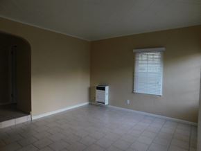 San Diego apartment for rent - an empty living room with a heater in the corner