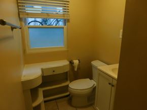 San Diego apartment for rent - a bathroom with a toilet and a window and a sink
