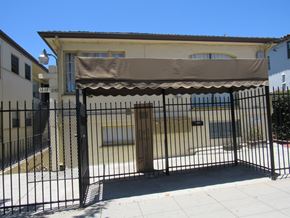 San Diego apartment for rent - a house with a fence and gate in front of it