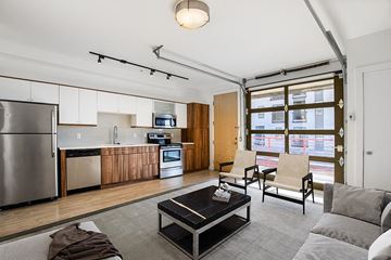 Denver apartment for rent - a living room with a kitchen and a couch