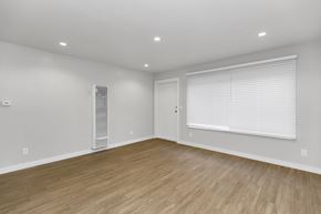 San Francisco apartment for rent - A room with wooden flooring and a window with blinds.