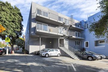San Francisco apartment for rent - A modern apartment building with a parking lot in front.