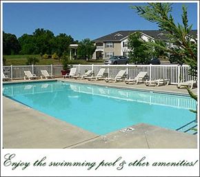 Statesville apartment for rent - a swimming pool with white chairs