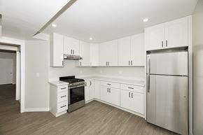San Francisco apartment for rent - A kitchen with white cabinets and stainless steel appliances.
