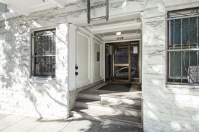 San Francisco apartment for rent - A white building with a door and windows.
