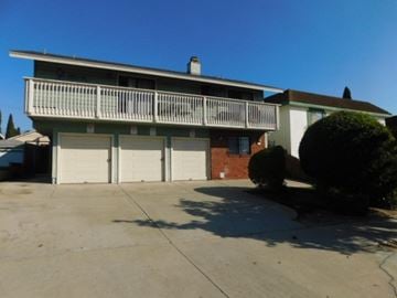 San Diego apartment for rent - A two-story house with a balcony and a garage.