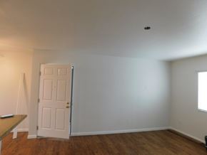 San Diego apartment for rent - an empty living room with a white door