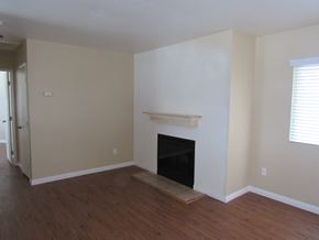 San Diego apartment for rent - a living room with a fireplace and a wooden floor