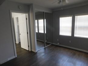 San Diego apartment for rent - A room with a white door and a window with blinds.
