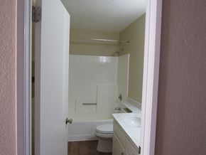 San Diego apartment for rent - A small bathroom with a toilet, sink and bathtub.