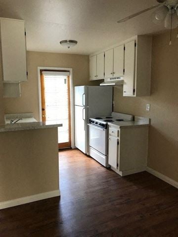 San Diego apartment for rent - A kitchen with a refrigerator, stove, and oven.