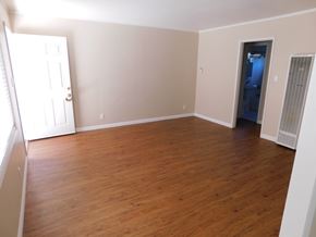San Diego apartment for rent - an empty living room with wood flooring and a closet