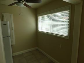 San Diego apartment for rent - a dining room with a window and a ceiling fan