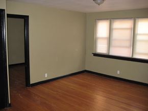 St. Louis apartment for rent - an empty room with wooden floors and a window