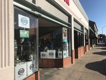 Salinas apartment for rent - a window display of a store with bags of coffee in it